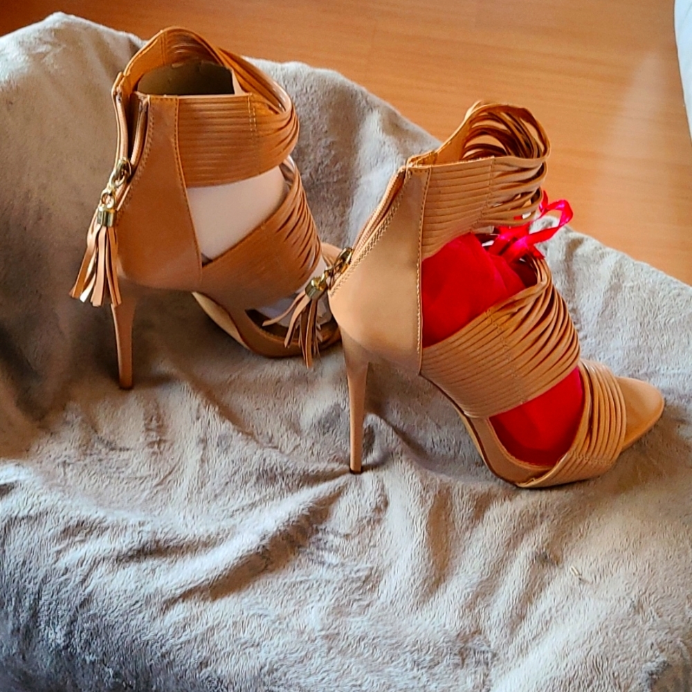 Beige open toe shoes with stiletto heels